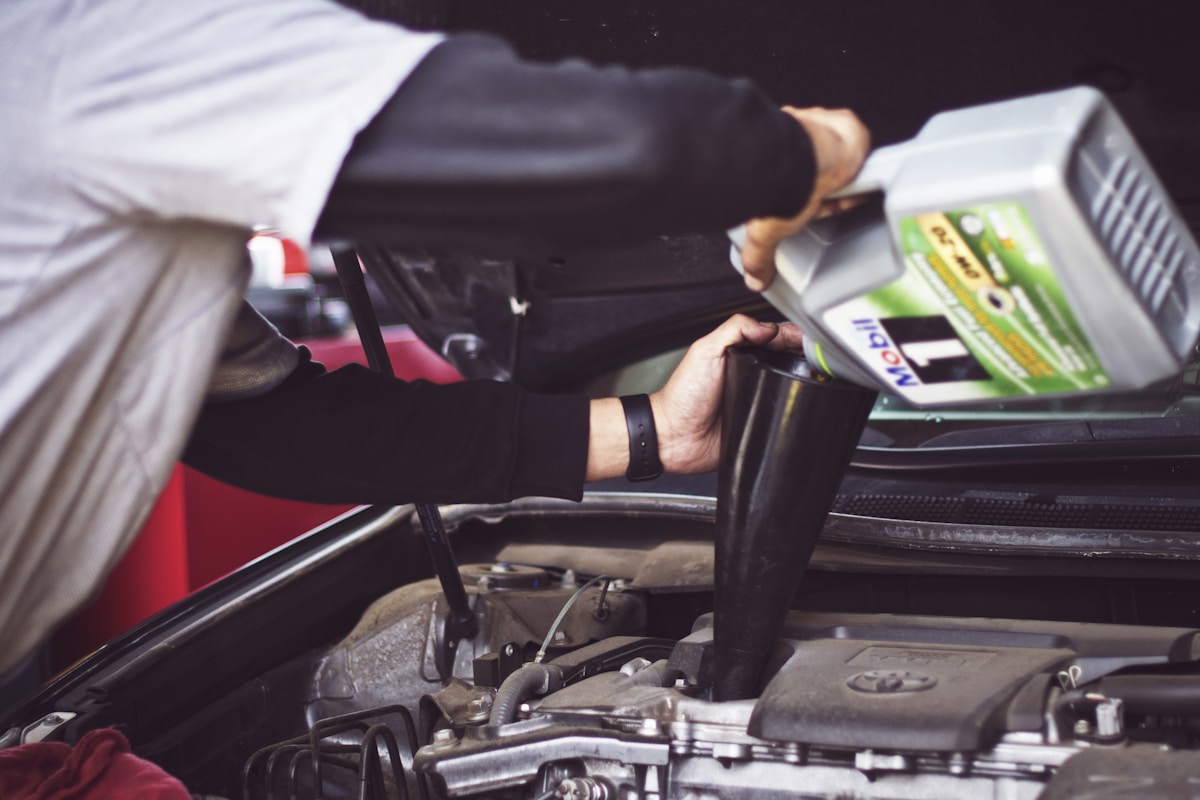 Transmission fluid being checked at auto repair shop